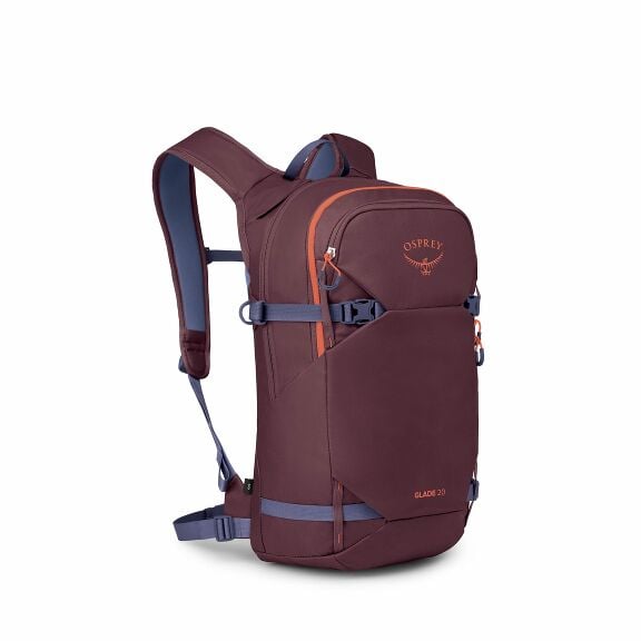 The image showcases an Osprey Glade 20 backpack, designed for outdoor activities. It features a rich burgundy color with subtle accents in orange, visible in the zipper and logo. The backpack has adjustable shoulder straps and a waist belt for a comfortab