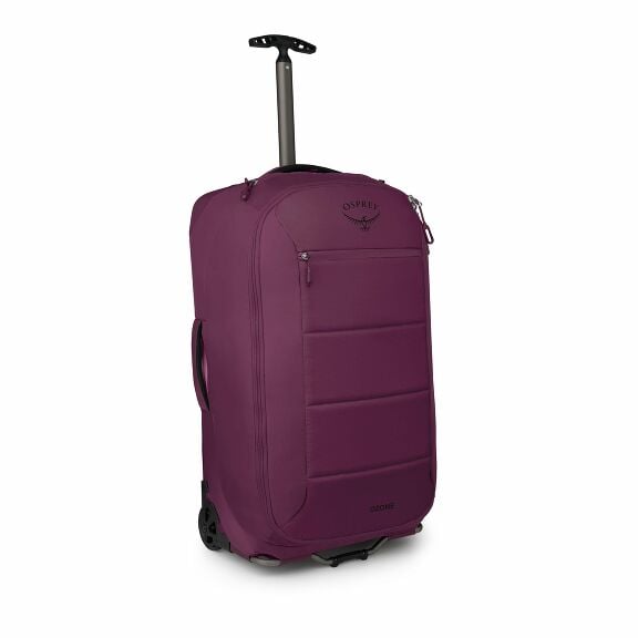 The image shows a purple wheeled suitcase from the brand Osprey, specifically from the Ozone series. The suitcase is upright with a retractable handle extended, allowing for easy transport. The design is sleek with smooth, curved edges, and features sever
