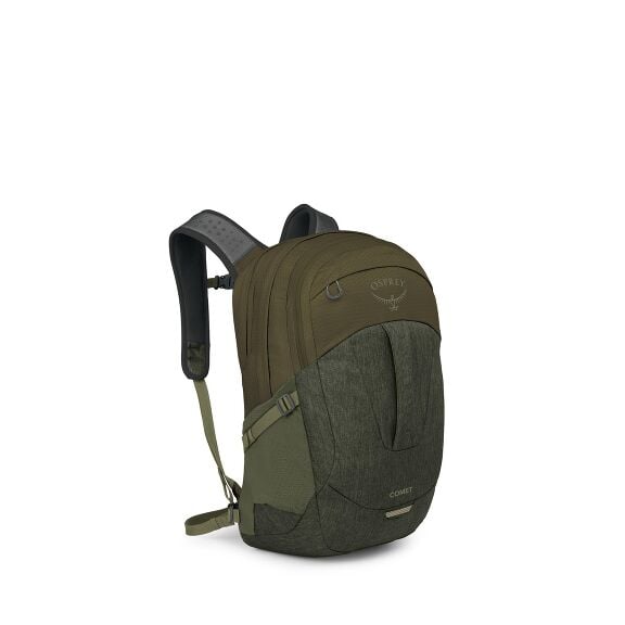 The image features a green Osprey Comet backpack, angled slightly to showcase both the front and one side. The backpack's design includes multiple compartments with zipper closures and an Osprey logo prominently displayed near the top. It also features ad