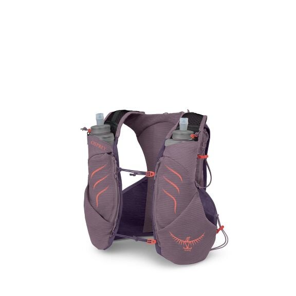 The image shows an Osprey branded running vest designed for hydration. It is a light purple color with coral accents and features two front pockets holding soft water bottles with spouts. The vest has adjustable straps and various compartments for carryin