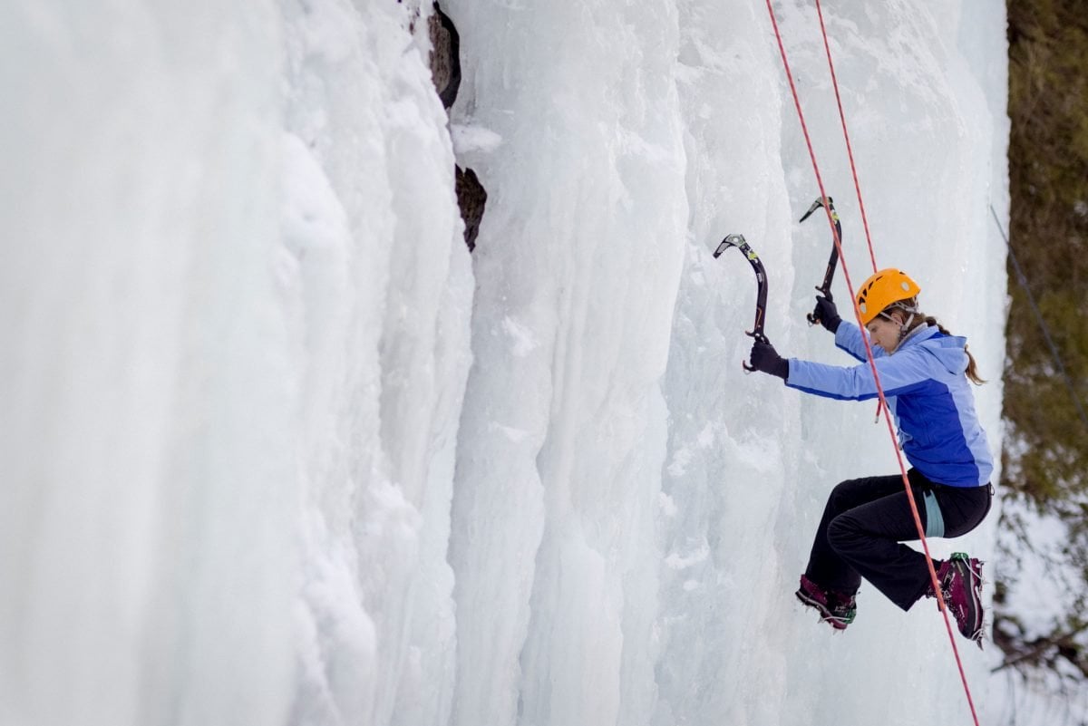 Woman ice climbing