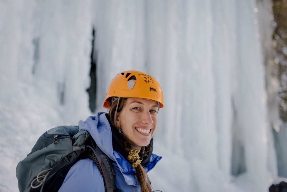 Woman ice climbing
