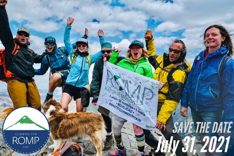 A group of climbers celebrating and holding a ROMP flag at a summit. Climbing for ROMP event - Save the Date: July 31, 2021