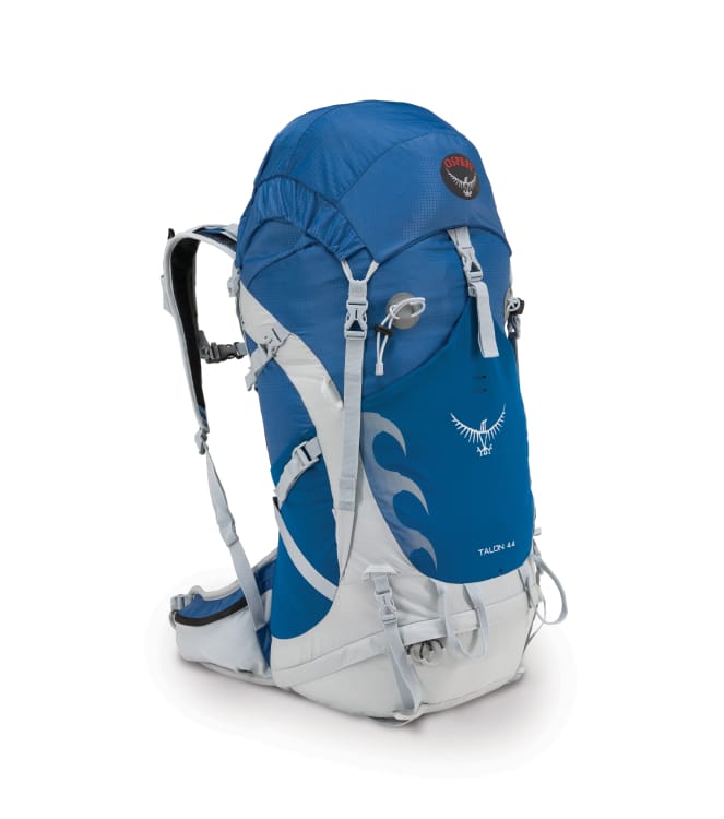 A cobalt blue backpacking pack with silver-white straps and features. The embroidery reads, &ldquo;Talon 44&rdquo; and bears the Osprey black, red and white logo.